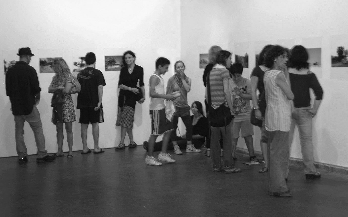 Today - Herzliya Biennial solo exibition - ohad matalon -visitors waiting to the end of the day - to take works off the walls -bw
